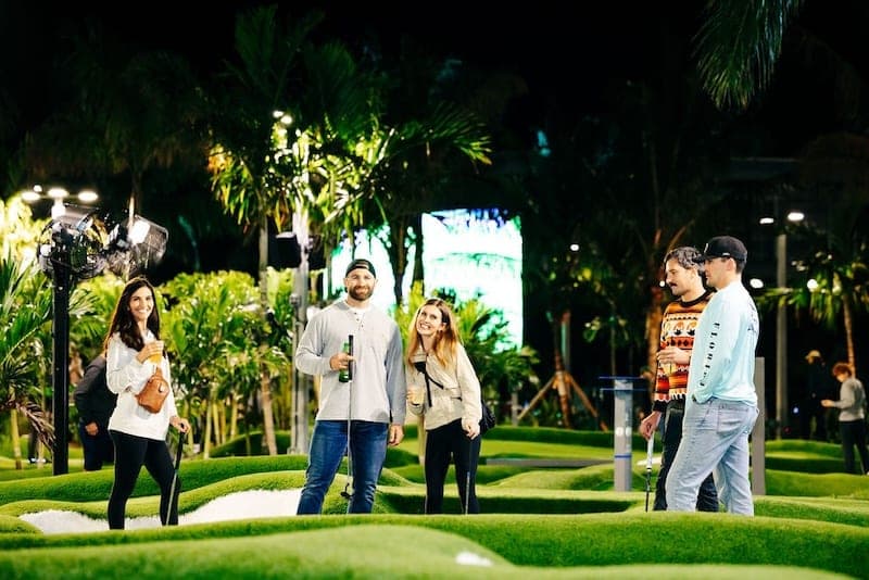 Guests on the mini-golf course at the 2025 Invitational